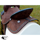 12’’ Double T Barrel style saddle with Oiled Rough out leather Teal buckstitch accents and flower conchos.
