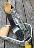 New! Showman ® Silver Engraved Stirrups with copper and teal feather concho. - Country Scene Saddlery and Pet Supplies