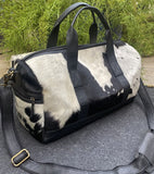 Showman ® White and Black hair on cowhide overnighter Duffle Bag. - Country Scene Saddlery and Pet Supplies