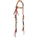 close up tribal beadwork and engraved rings western headstall