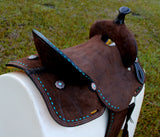 New! 14", 15" Double T Barrel style saddle with Oiled Rough out leather, Teal buckstitch accents and flower conchos. - Country Scene Saddlery and Pet Supplies