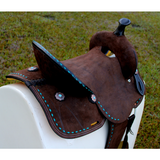 14’’ 15’’ Double T Barrel style saddle with Oiled Rough out leather Teal buckstitch accents and flower conchos.