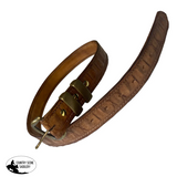 Brown leather belt with brass buckle on a white background