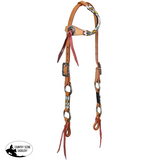 close up tribal beadwork and engraved rings western headstall
